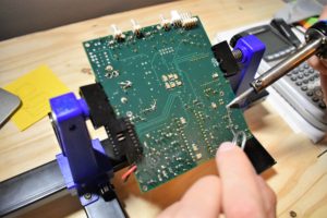 Leveraging a circuit board holder to solder in components