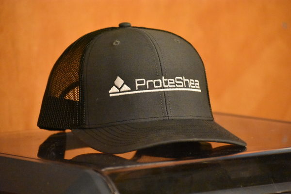 Richardson trucker hat that says ProteShea the front of it